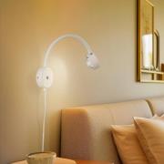 Lindby vägglampa Jyla, vit, lins, 4.200 K, GX53, flexibel arm