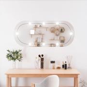 vidaXL Väggspegel med LED-belysning 25x60 cm glas oval